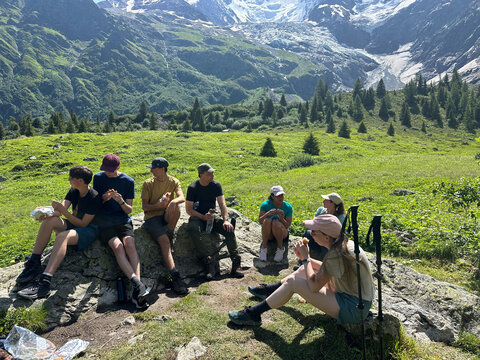 UGC of group resting on a trail,  Tour du Mont Blanc, Alps
