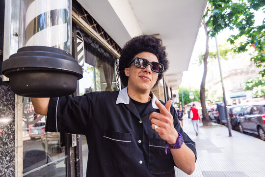 Cool barber with afro hair portrait 