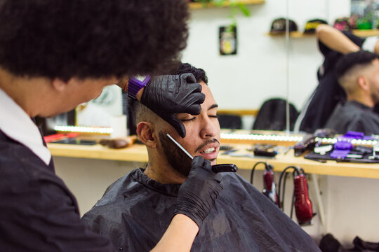 Barber using straight razor 