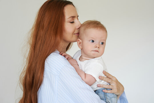 Mom inhales her baby's fragrance