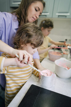 Mom and son cooking cream