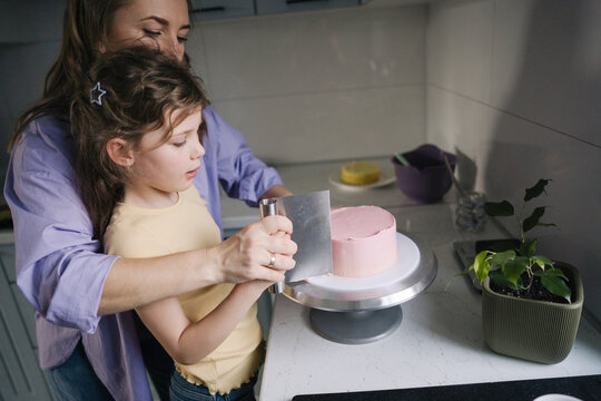 Mother and daughter on the kitchen