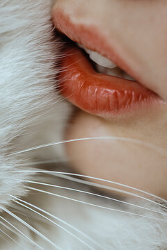 Close Up woman's red lips with white fur