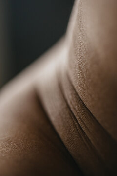 Close up photo of woman's skin texture of belly skin folds
