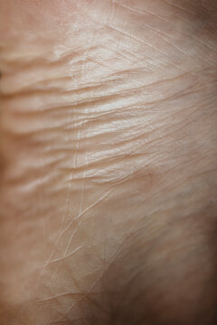 Close up photo of woman's skin texture of feet 