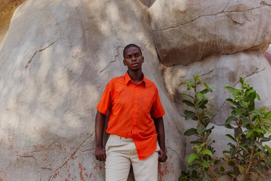 Young black model stood in front of rocks