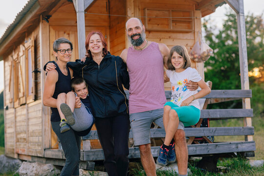 Family Portrait in front of their Home