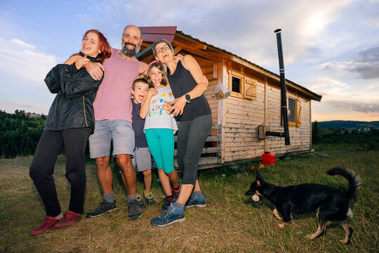 Excited Family in front of their New House