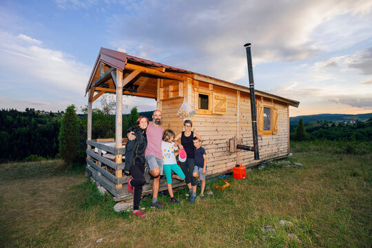 Portrait of a Happy Family in front of their House