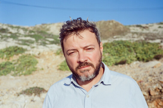 Man with Beard in Rocky Landscape