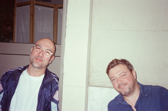 Two Old Friends Gathered Smiling at the camera