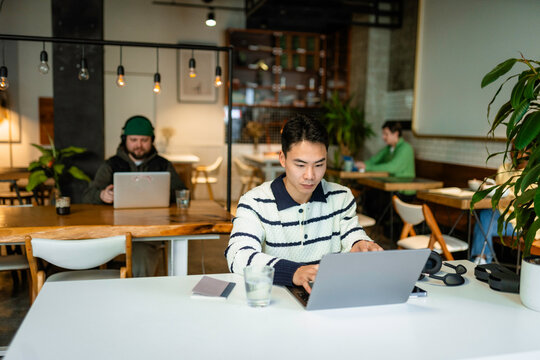 A group of people work in a coworking space