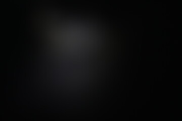 Una toma de cerca de un fondo abstracto de color gris y negro con un desenfoque ligero © Elika R