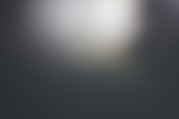 Una toma de cerca de un fondo abstracto de color gris y negro con un desenfoque ligero © Elika R