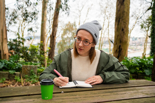 Woman writing in a notebook

