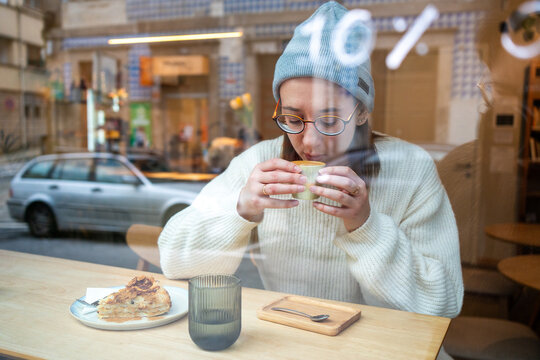 Woman enjoying coffee at a cafe