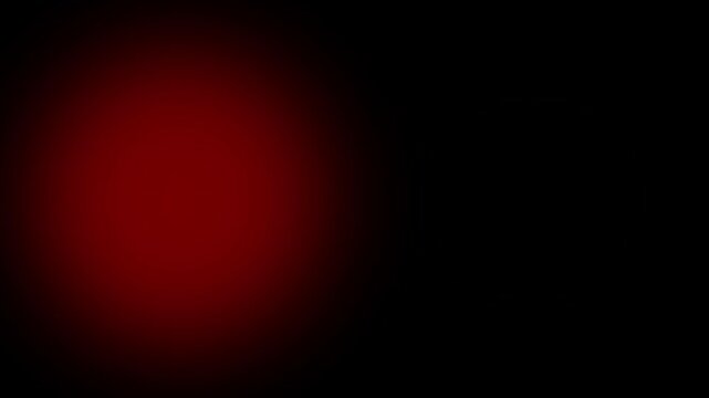 Dark background with a soft red gradient spotlight effect creating a dramatic and moody atmosphere with deep shadows and vibrant crimson highlights on the right side of the frame