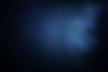 Fototapeta premium Una toma de cerca de un fondo abstracto de un color azul con negro con un degradado ligero desenfocado