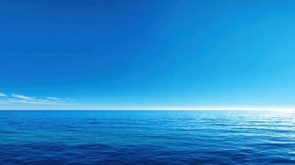 Obraz premium Tranquil Blue Ocean Scene with Clear Sky and Gentle Waves Under Bright Sunlight for Peaceful and Relaxing Background Use
