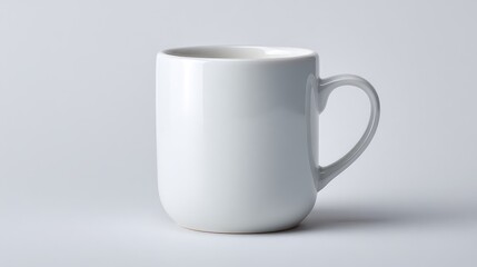 Fototapeta premium Minimalistic White Coffee Mug with Smooth Surface on Neutral Background Ideal for Beverage Photography and Modern Table Settings