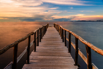 Fototapeta premium Wooden pier on Lake Titicaca at sunset