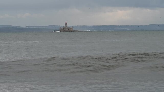 Ocean swell forming near Bugio lighthouse offshore