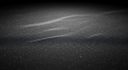Close up of Sparkly Dark Textured Surface with Wavy Patterns