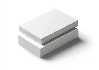 Two stacks of blank rectangular cards, one atop the other, casting a shadow on white