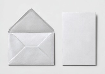 Open envelope next to a blank card on a white background, studio shot