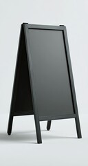 A tall, black, empty A-frame chalkboard sign stands against a bright, clean background