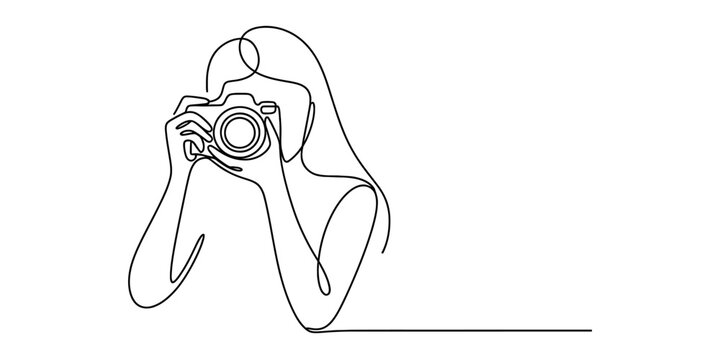 Continuous line drawing of a woman photographer holding a professional camera to her eye.