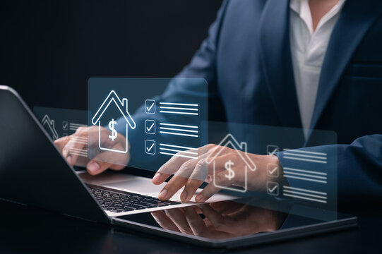 Digital mortgage approval and online home financing process. businessman using laptop with digital mortgage approval interface and online home loan checklist, real estate financial technology