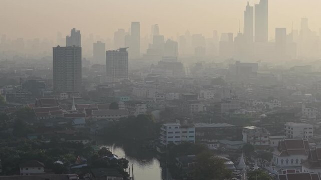 Aerial view PM2.5 smoke on city building sunrise pollution of Bangkok Thailand