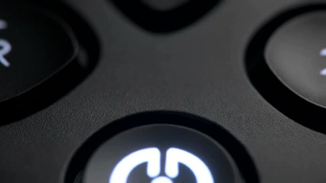 Power Button Closeup on Electronic Device.