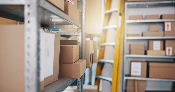 Warehouse, logistics and ladder with boxes for inventory, storage unit or supply chain delivery. Empty, small business or shipping storeroom for packages, cargo or stock control in freight depot