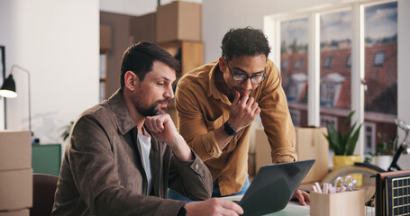 Logistics, review or team in office with laptop, order track or inventory management for shipping....