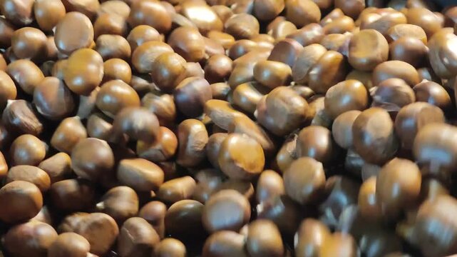 Roasted chestnuts in a pan.