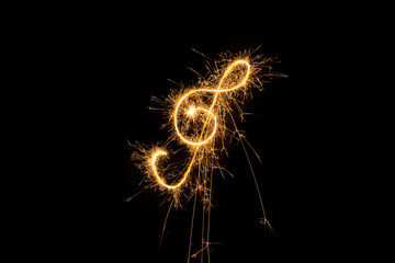 Golden Treble Clef Sparkler Fireworks on Black Background