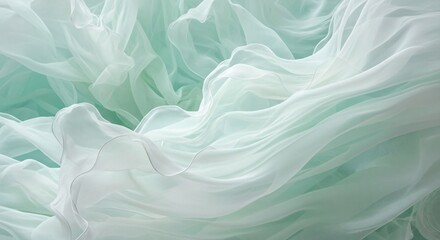 Fototapeta premium A close-up view of flowing white and green fabric with soft folds and gentle curves