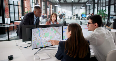 Real Estate Agent Surveying Land Using Cadastre Map © Andrey Popov