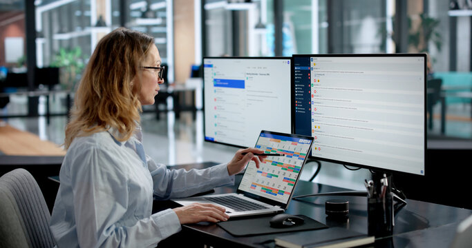 Businesswoman Schedules Meetings And Emails On Digital Calendar