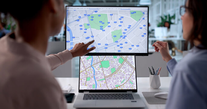 Young Black Woman Using Computer To Map Real Estate Properties