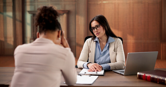 Sad Woman Consults Angry Lawyer After Divorce Mediation Proceedings