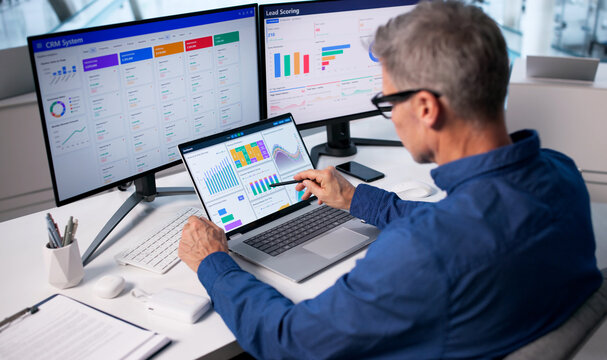 Financial Analyst Man Using CRM System