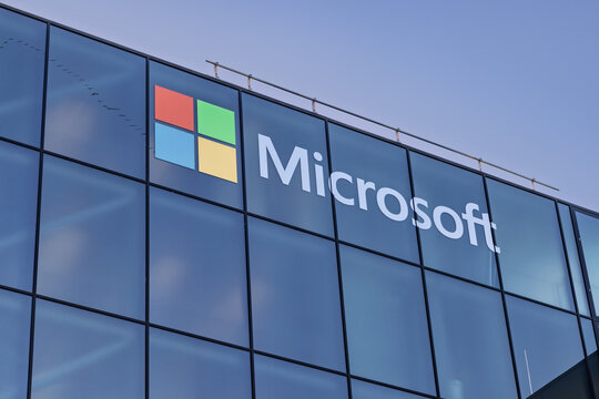 Close-up of the Microsoft logo and branding on a modern glass office building facade at Schiphol, Netherlands. 8 February 2026.