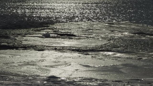 Melting Ice Floes Floating On Water Surface During Spring Thaw 