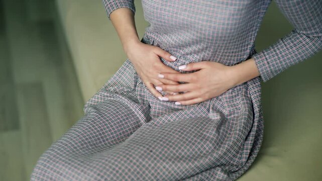 Woman Feeling Sharp Stomach Pain. Woman Having Menstrual Ache. Painful Body Condition