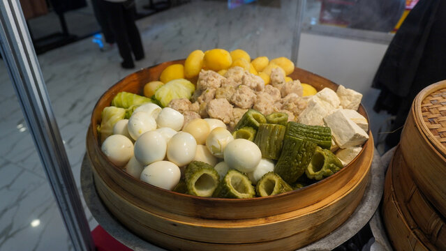 Siomay (also Somai), is an Indonesian steamed fish dumpling with vegetables served in peanut sauce. It is derived from Chinese Shumai. It is considered a light meal that is a type of Chinese Dim Sum.