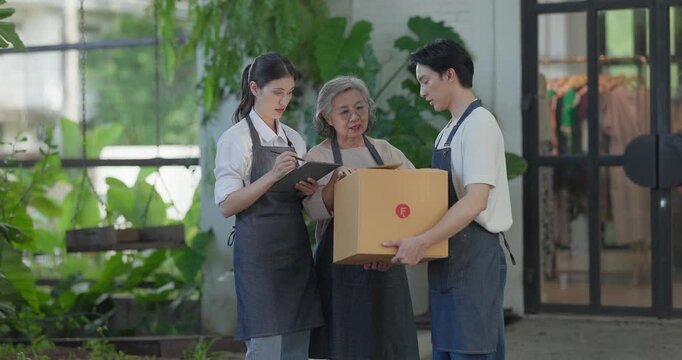 Mother, daughter, and son pose outside their family run ceramic shop and warehouse, presenting a friendly, professional team ready for retail and wholesale customers.
