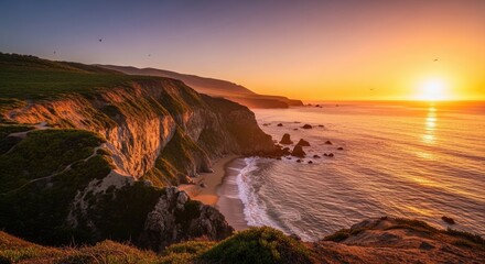 Obraz premium Coastal Sunset Over Rugged Cliffs and Ocean.